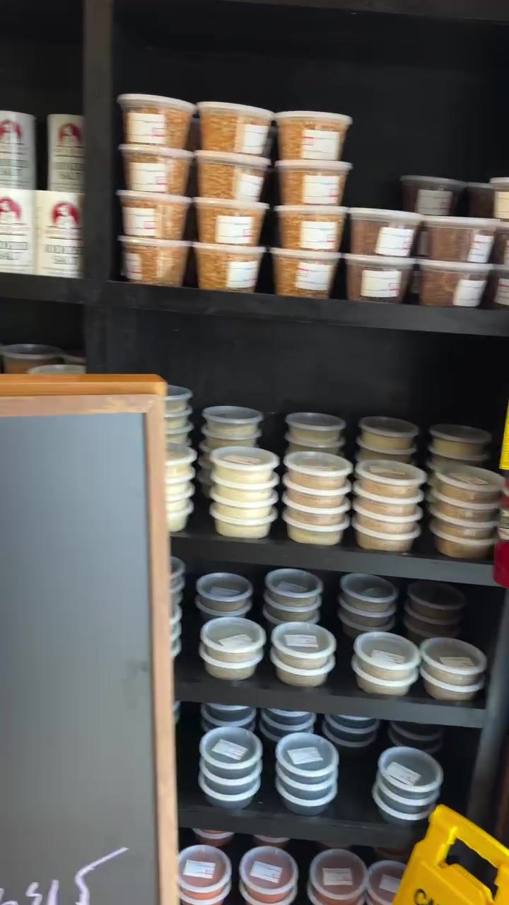 Shelves of house-packed Ethiopian spices in jars